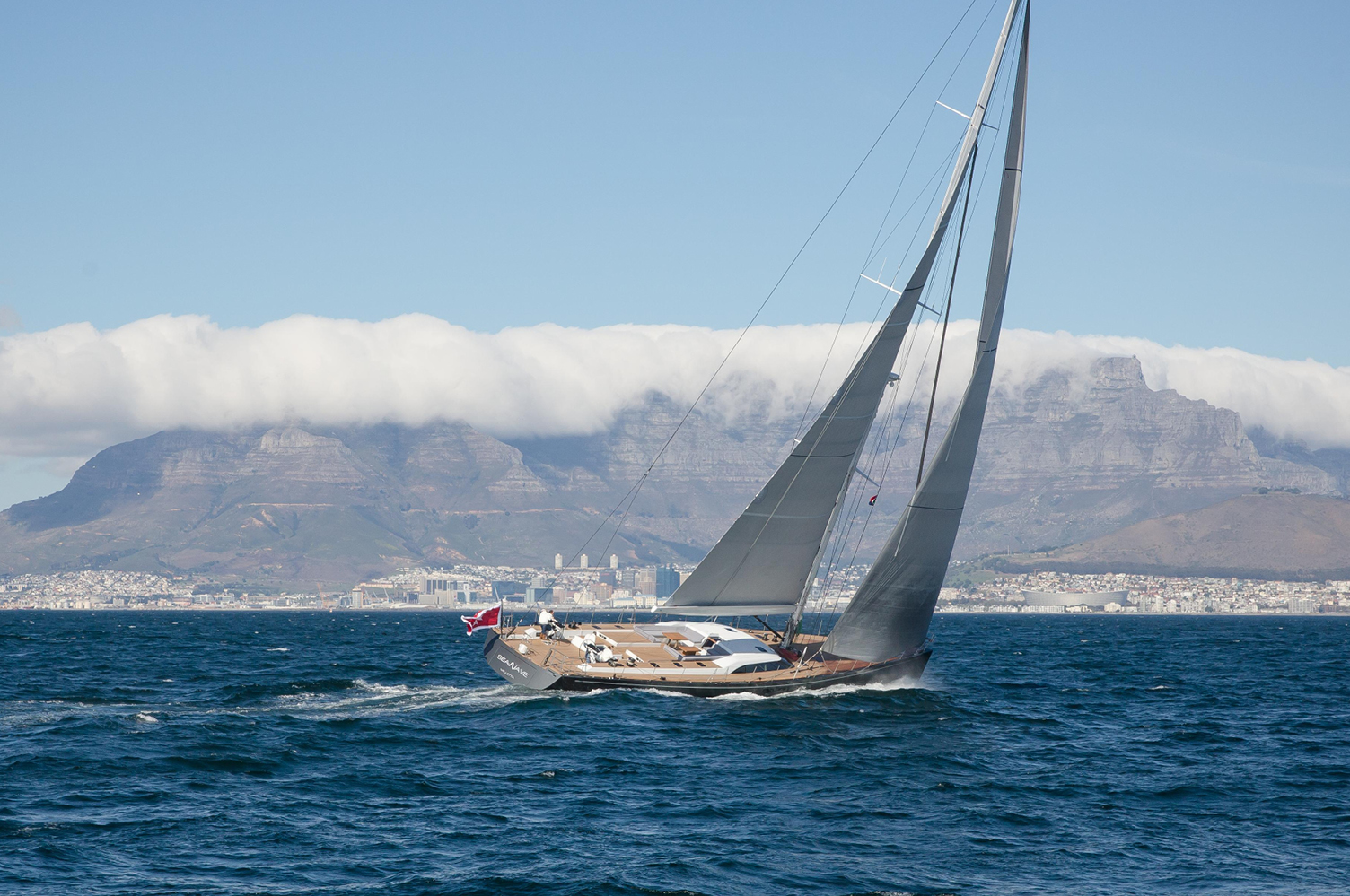 Super Yacht 'Seawave', a Southern Wind 102, featuring Ullman Sails Super Yacht Series sails. 'Seawave' shown here sailing in front of Table Mountain in Cape Town, South Africa. Images courtesy of Southern Wind Shipyard, Photography of Rob Kamhoot